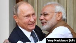 Indian Prime Minister Narendra Modi (right) hugs Russian President Vladimir Putin before their meeting in New Delhi in October 2018.