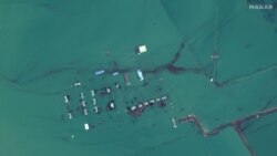 A satellite image shows flooded homes near the Uzbek-Kazakh border following the collapse of the dam.