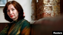 Natalya Estemirova poses at the Front Line Club in London in 2007, where she was awarded the first annual Anna Politkovskaya award for women defenders of human rights in war.