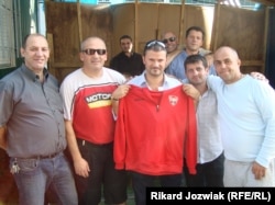 FC Kosova's president Abazi Xhevat (center) has big plans for the club.