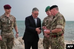 British Prime Minister Keir Starmer meets military personnel in Bahrain on April 9 during a three-day visit to the region.