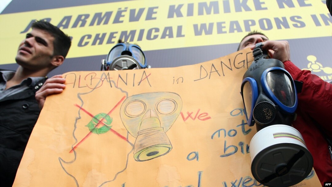 Environmental activists protest against the proposed chemical weapons plan outside a government building in Tirana on November 13.