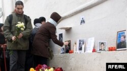 Mourners lay flowers and light candles on January 20 at the site of Markelov's slaying.