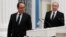 Russian President Vladimir Putin (R) and his French counterpart Francois Hollande arrive to hold a press conference after their meeting in Moscow on November 26, 2015.
