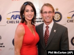 Nadia Comaneci with her husband, Bart Conner, in 2009.