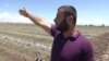 Armenia - A farmer in Armavir province shows his fields hit by a powerful hailstorm, 13Jun2017.