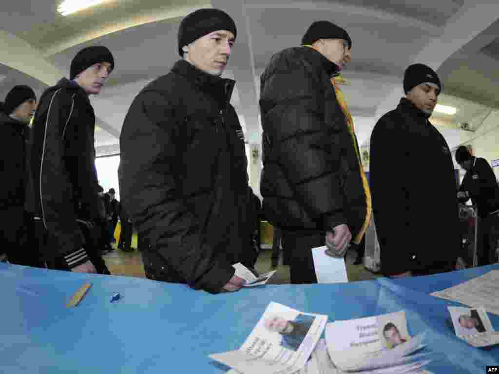 Ukrainian inmates wait their turn to vote inside a penitentiary in Lviv.