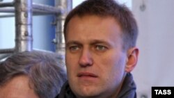 TV personality Kseniya Sobchak and protest blogger Alexei Navalny attend an opposition protest at Sakharov Prospekt in central Moscow