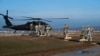 Kosovo -- Members of the US Arm, part of the NATO-led peacekeeping mission in Kosovo (KFOR), board a helicopter as they take part in a US military exercise at Camp Bondsteel, near the village of Sojevo, January 22, 2015