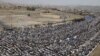 Antigovernment protesters attend Friday Prayers during a demonstration in Sanaa on June 10.