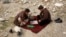 Afghanistan -- Men play chess in Kabul January 13, 2014.