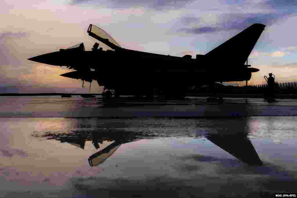 British Royal Air Force Typhoon jets repose on the tarmac at an Estonian Air Force base located in Amari. (epa-EFE/SAC Ed Wright)