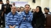 Vahid Behzadi and Najva Lashidayi, defendants in disrupting Iran's foreign exchange market case. 