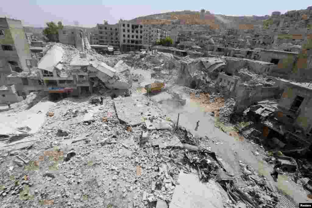 A general view shows the damage after a Syrian Army fighter jet crashed into a busy marketplace in the rebel-held northwestern town of Ariha. At least 27 people were killed and dozens injured. (Reuters/Ammar Abdullah)