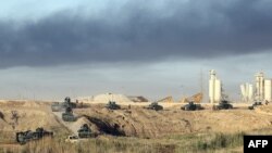 Фаллуджа қаласы бағытында кетіп бара жатқан Ирак әскери техникалары. 23 мамыр 2016 жыл.