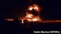 Пожар, возникший после нападения боевиков на бензовозы для сил НАТО