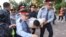 KAZAKHSTAN -- Law enforcement officers detain a man during an opposition rally held by critics of Kazakh President Kassym-Jomart Tokayev, who protest over his election in Almaty, Kazakhstan June 12, 2019.