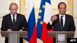 Russian President Vladimir Putin (left) met in Paris with French President Francois Hollande in June.
