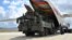 The first parts of a Russian S-400 missile-defense system are unloaded at an air base near Ankara on July 12.