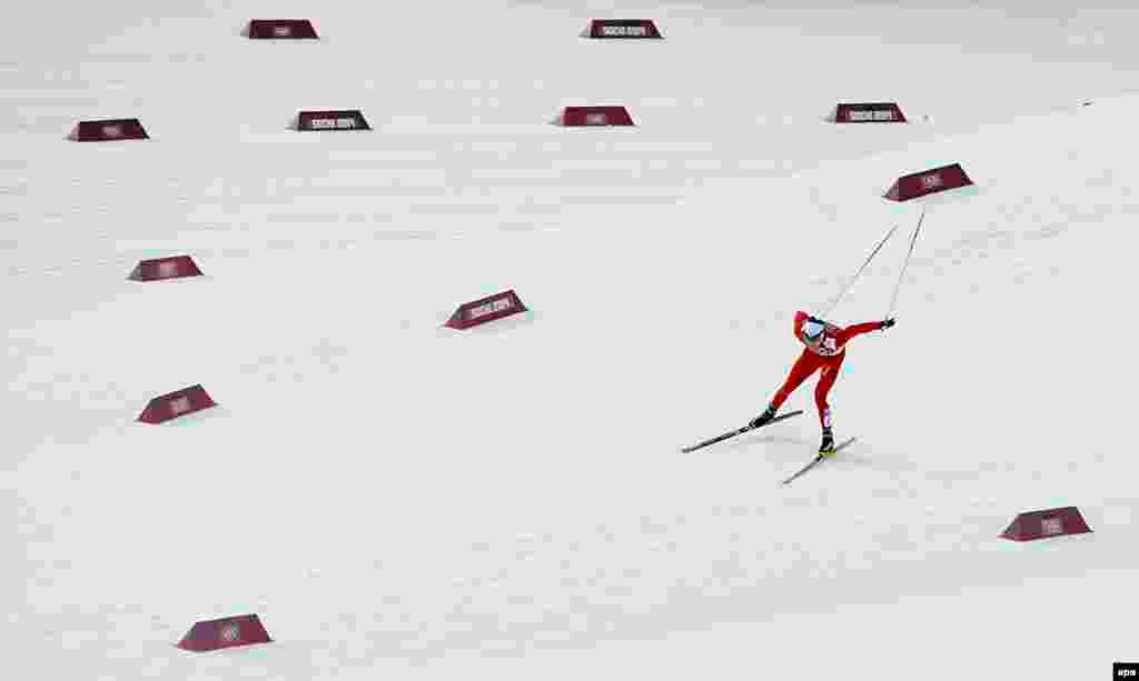 Dario Cologna of Switzerland in action during the men&#39;s 15km + 15km skiathlon competition in the Laura Cross Country Center. Cologna won the gold medal.