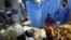 A wounded Iraqi man receives treatment in a hospital following two bombings targeting the country's ethnic Shabak community. 