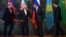 Russian Foreign Minister Sergei Lavrov (second from right) jokes with Iranian counterpart Mohammad Javad Zarif (second from left) as Azerbaijan's Elmar Mammadyarov (left) and Kazakhstan's Kairat Abdrakhmanov look on.
