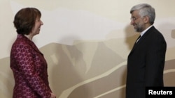  Iran's Chief negotiator Saeed Jalili (R) and European Union Foreign Policy chief Catherine Ashton stand for a photograph before talks in Almaty in April.