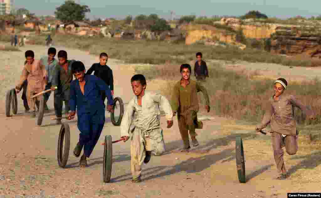 Afghan refugee children play in Islamabad, Pakistan. (Reuters/Caren Firouz)