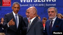 U.S. President Barack Obama (L) gestures next to Afghanistan's President Ashraf Ghani (C) and Afghanistan's Chief Executive Abdullah Abdullah at the NATO Summit in Warsaw, Poland on July 9.