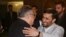 Ahmadinejad (right) greeting Talabani in Tehran on November 27