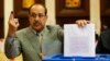 Iraqi Prime Minister Nuri al-Maliki votes during parliamentary elections in Baghdad on April 30.
