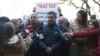 Armenia -- Protesting employees of the Republican Center for the Prevention of AIDS talk to reporters outside the main government building in Yerevan, February 27, 2020.