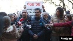 Armenia -- Protesting employees of the Republican Center for the Prevention of AIDS talk to reporters outside the main government building in Yerevan, February 27, 2020.