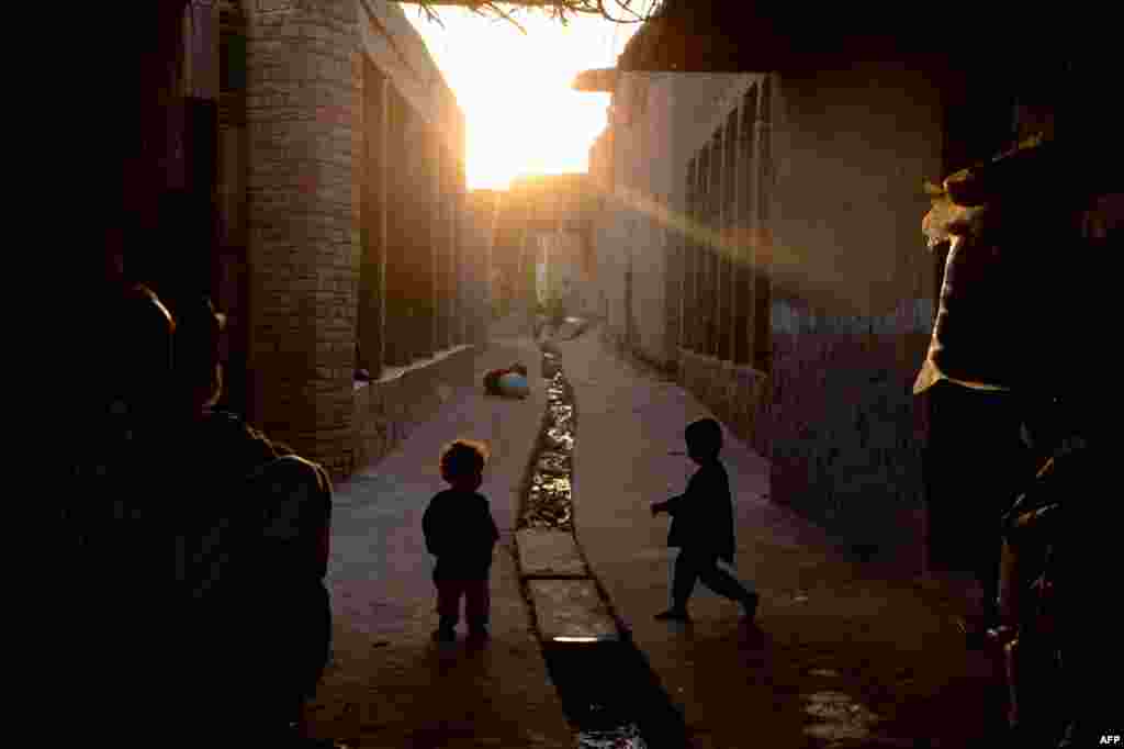 Afghan children play in a street on the outskirts of Jalalabad. (AFP/Noorullah Shirzada)