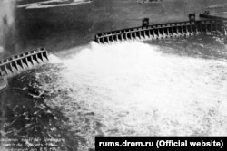 Water surges through the DniproHES dam after Red Army Forces destroyed it upon their retreat.