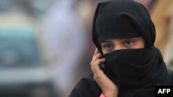 A woman talks on her mobile phone in Rawalpindi. (file photo)