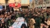 Caskets of those who died in a terror attack on a military parade in Iran are displayed in Ahvaz, September 24, 2018