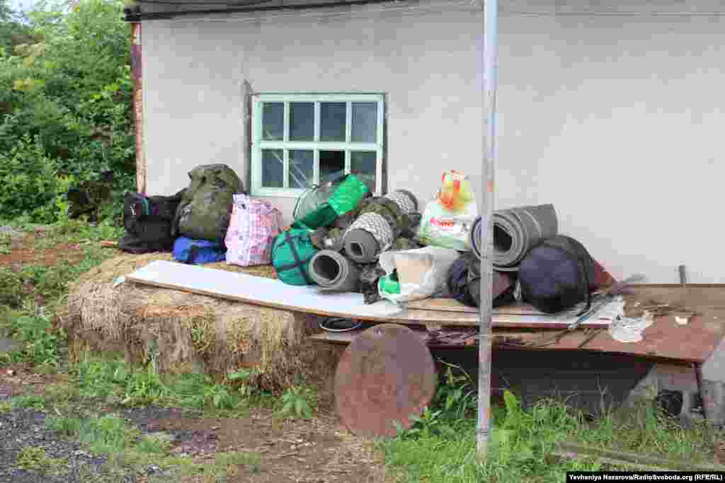 Backpacks and other things prepared at the battalion headquarters to be taken to the front