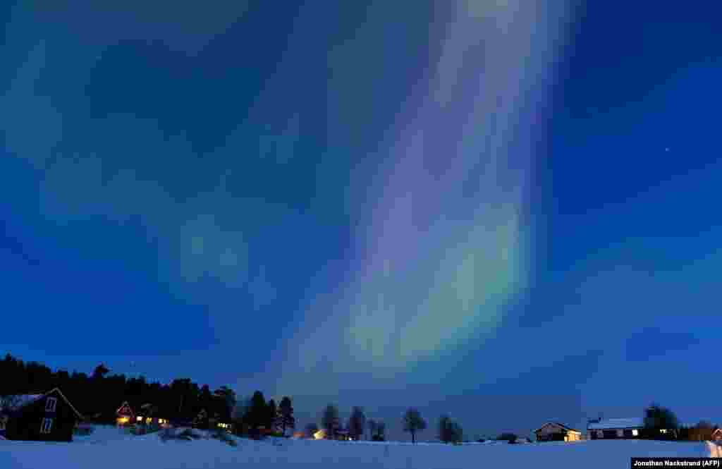 The Aurora Borealis, or northern lights, illuminate the sky over the Swedish towns of Are and Ostersund on March 17.