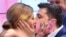 Ukraine - Ukrainian comedian and presidential candidate Volodymyr Zelensky kisses his wife Olena after the announcement of the first exit poll results in the second round of Ukraine's presidential election at his campaign headquarters, Kiev, 21apr2019