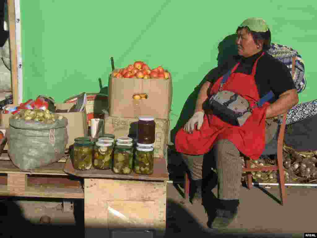 A woman selling homemade pickles in an Ulan Bator market. - Mongolians have picked up a few culinary preferences from neighboring Russia over the years, including a taste for sour homemade pickles. Numerous women at markets can be spotted wearing cabbage leaves on their heads, which are believed to relieve headaches caused by high blood pressure.