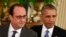 U.S. President Barack Obama (right) and French President Francois Hollande arrive for a joint news conference after their meeting at the White House on November 24.