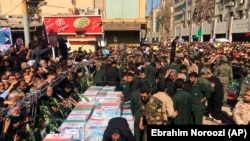 Caskets of those who died in a terror attack on a military parade in Iran are displayed in Ahvaz, September 24, 2018