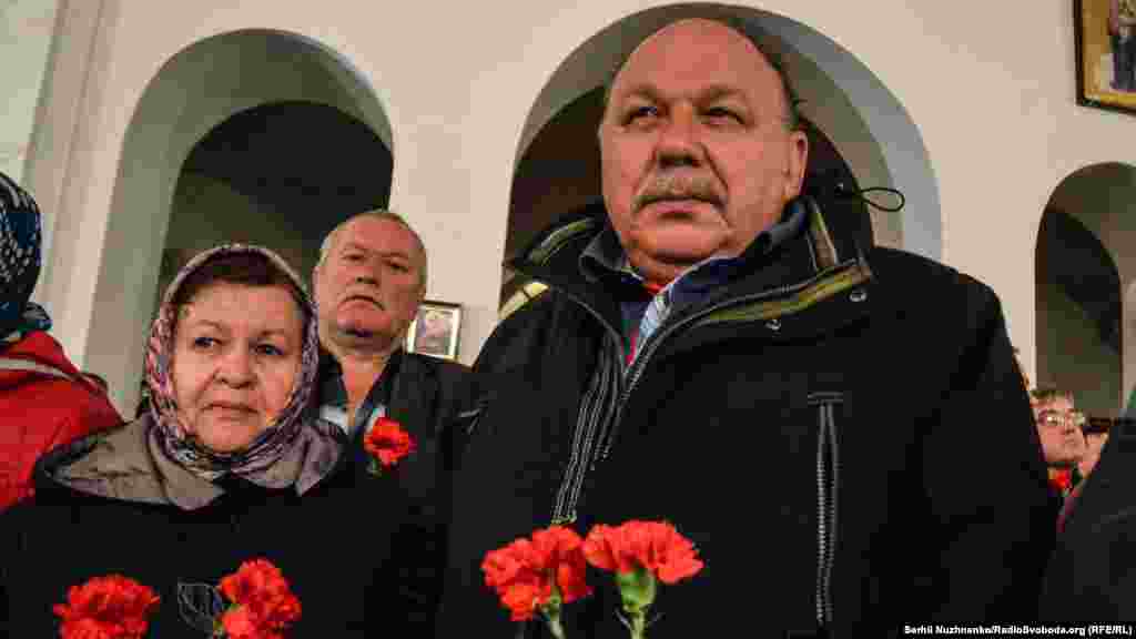 Ukraine -- Honoring Chornobyl liquidators in Kyiv near Chernobyl church, 26Apr2016