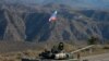 A member of the Russian peacekeeping troops stands next to a tank near the border with Armenia following the <a href="https://www.rferl.org/a/russian-peacekeepers-deploy-to-nagorno-karabakh-after-truce-as-political-crisis-hits-armenia/30940268.html" target="_blank"><strong>signing of a deal to end the military conflict</strong></a> between Azerbaijan and ethnic Armenian forces in Nagorno-Karabakh.<br />
<br />
More than 400 Russian troops of a planned 2,000 were already being put in place on November 11 as part of a renewable five-year peacekeeping mission.