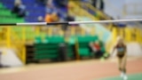 GENERIC – Unrecognizable sportswoman before high jump attempt over bar on track and field competition