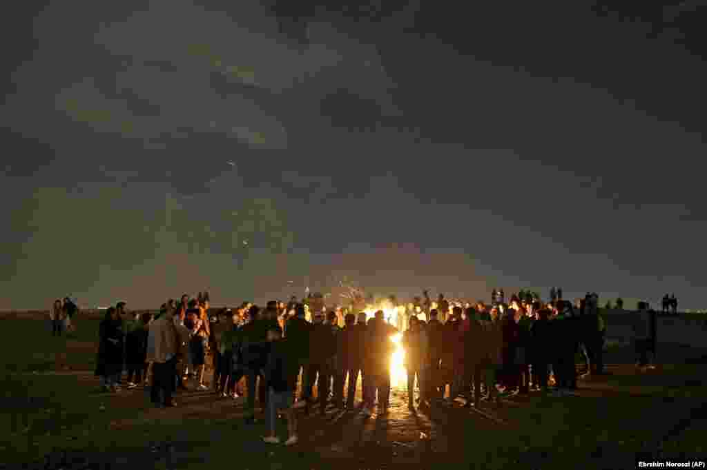 Iranians light fireworks during a celebration, known as &quot;Chaharshanbe Souri,&quot; or Wednesday Feast, marking the eve of the last Wednesday of the solar Persian year, Tuesday, March 19, 2019 in in Tehran, Iran. &nbsp;