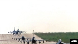 Italy -- Dutch and Belgium F-16 aircrafts line up for take off to continue air raids on Serb targets, Amendola, 25Mar1999