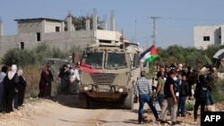 იორდანეს დასავლეთ ნაპირზე, პალესტინელთა ოკუპირებულ ტერიტორიაზე ლტოლვილთა ბანაკ ნურ შამის მცხოვრებთა და სხვა აქტივისტების სოლიდარობის აქცია, რომლის მონაწილეები მოითხოვენ პალესტინელებისთვის თავიანთ სახლებში დაბრუნების უფლებას. 23 ნოემბერი, 2025 წელი (საილუსტრაციო ფოტო)
