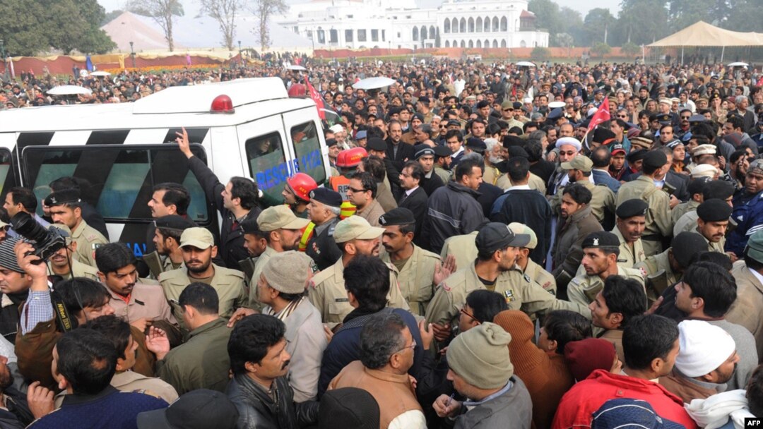 Supporters and activists of the ruling Pakistan People's Party (PPP) follow the funeral procession of assassinated Punjab Governor Salman Taseer in Lahore on January 5.